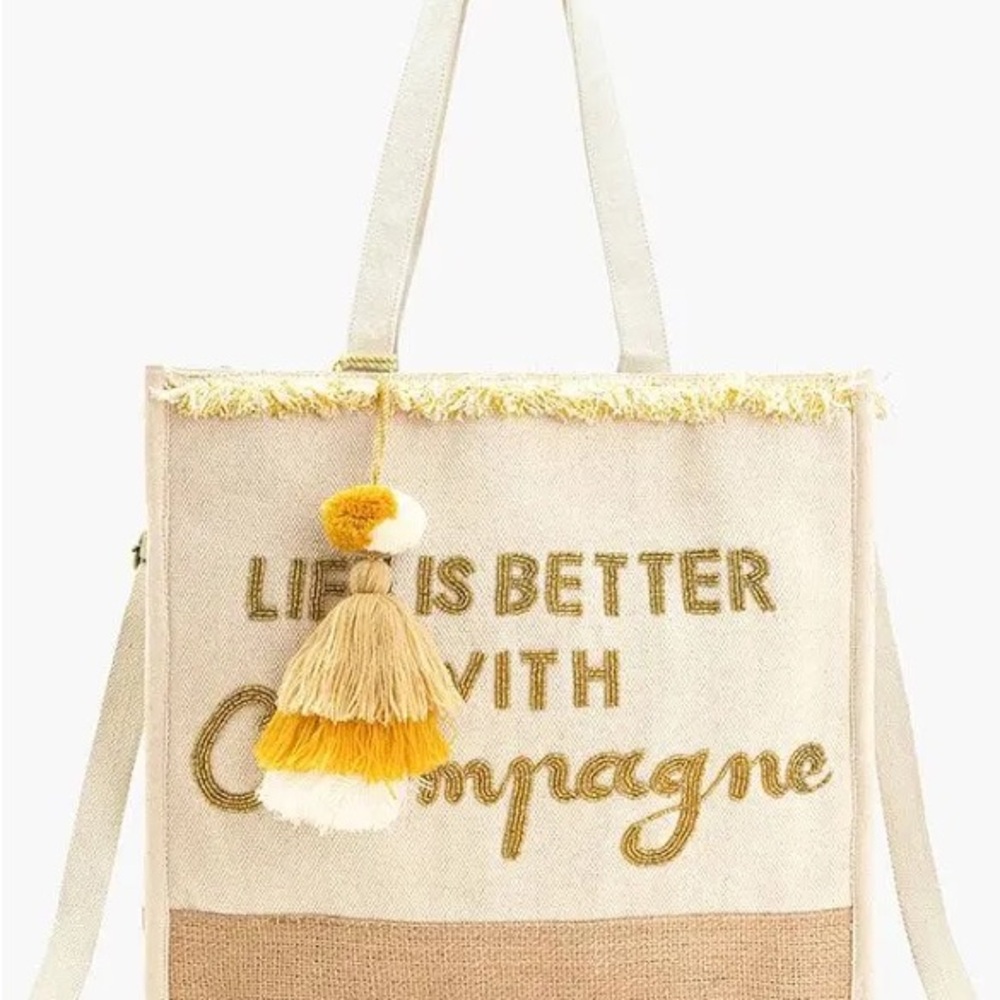 America and Beyond Cream and Gold Tote Bag with beaded letters and tassel